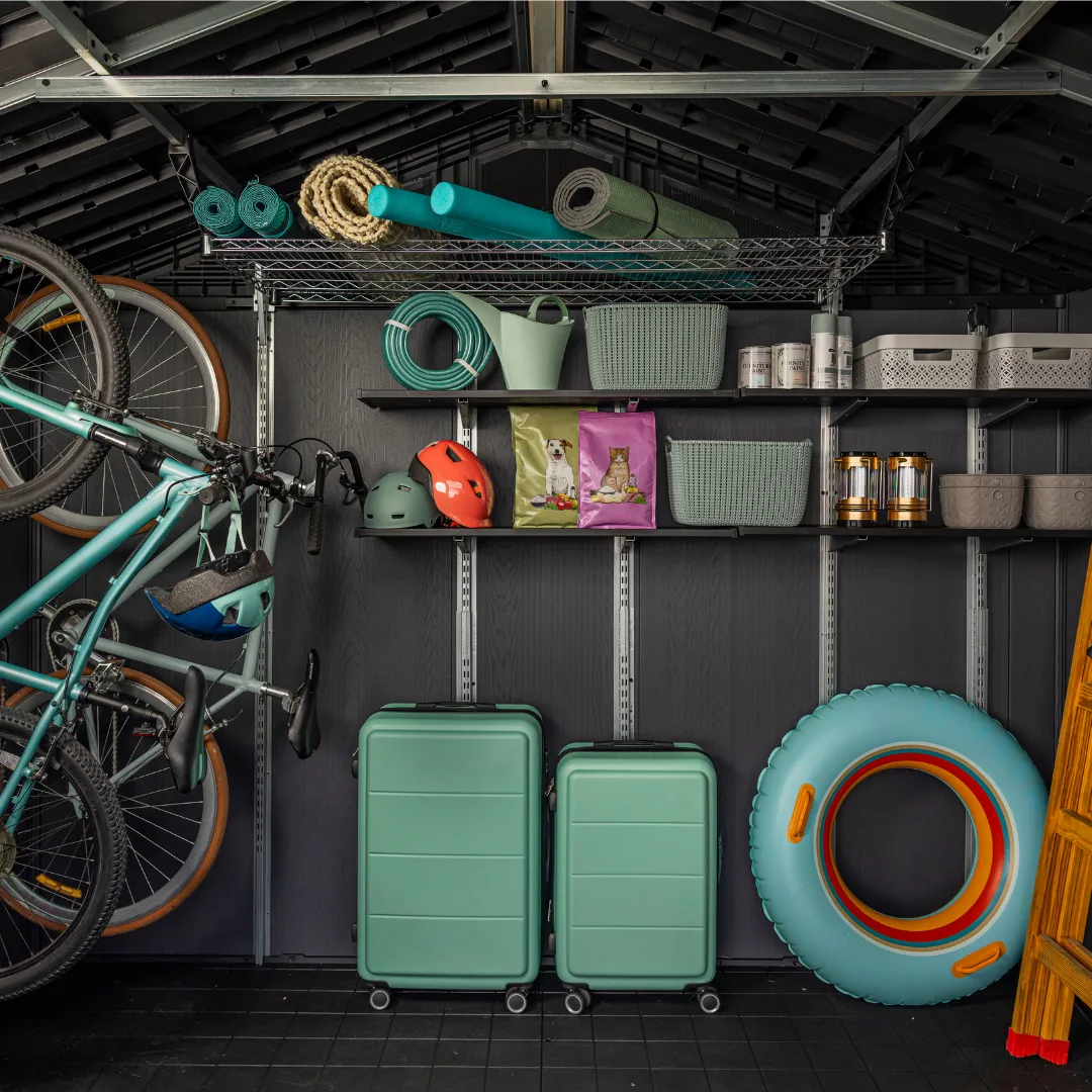Organized interior of a Keter Stronghold shed with bikes and garden tools